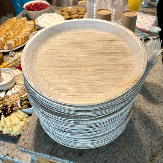 NEATtable compostable palm leaf plates at a breakfast buffet.