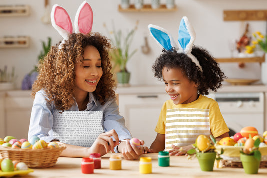 Mom and daughter wearing NEATsheets when dying Easter eggs.