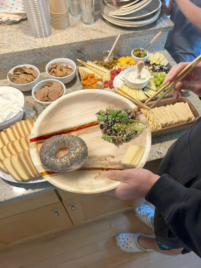 NEATtable compostable palm leaf plate being used at a brunch