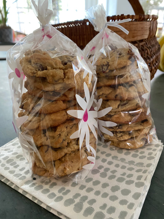 Two packages of freshly baked cookies and Grey Dot NEATsheets.
