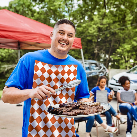 Man wearing a NEATsheet adhesive napkins at a football tailgate.
