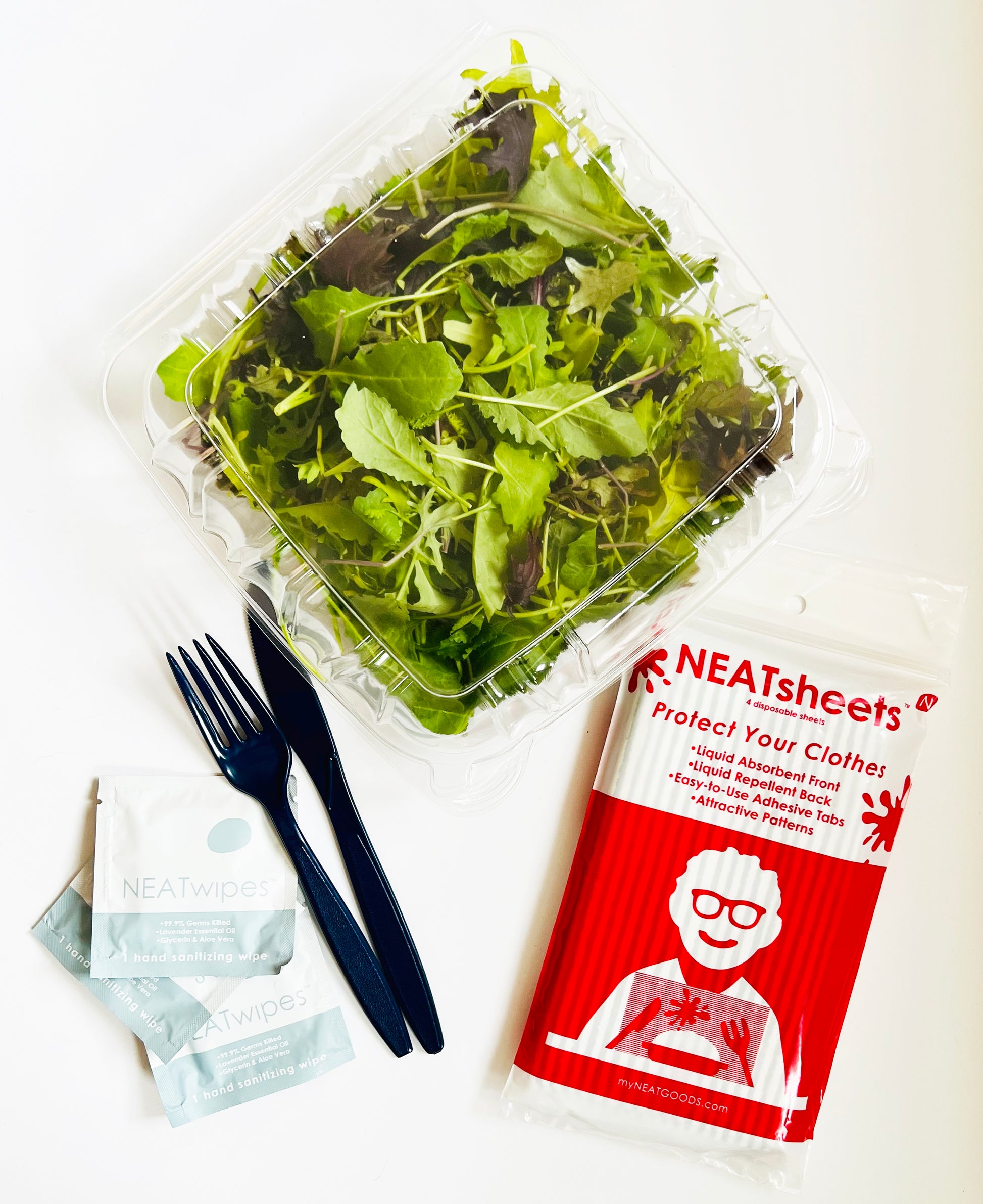 NEATsheets 4-Count Pack next to a to-go salad